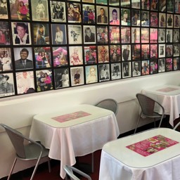 Wall of famous actor photos inside Pink's Hot Dogs